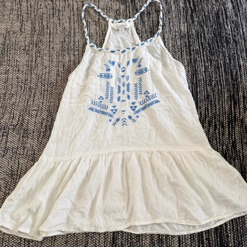 Charming Charlie white babydoll top with blue embroidered floral